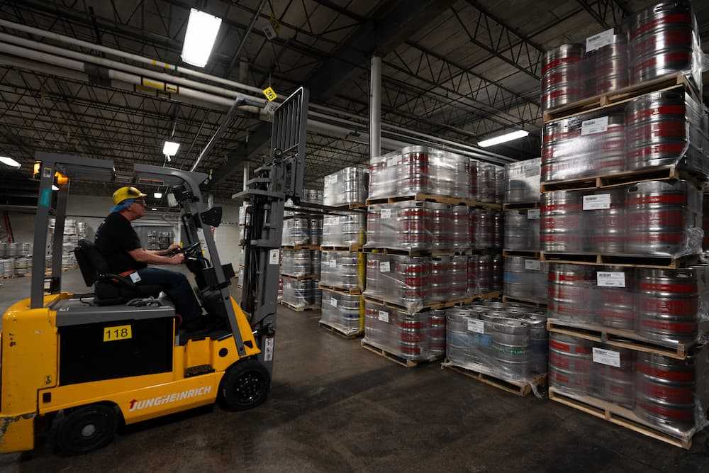 Photo of an employee on a forktruck Photo of an employee on a forktruck