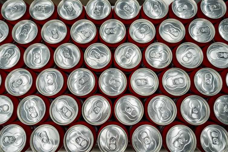 Top-down photo of many beverage cans Top-down photo of many beverage cans